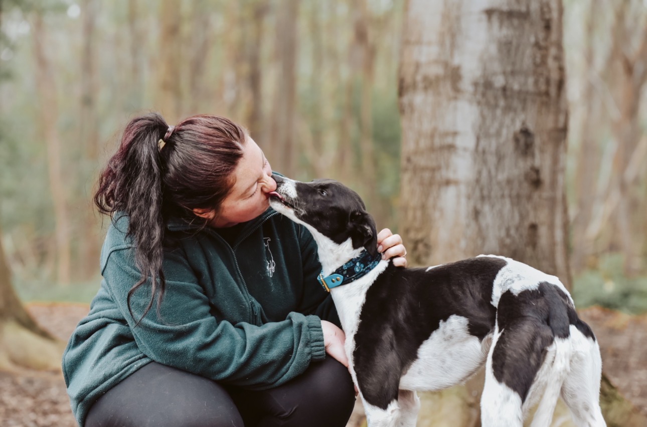 India's rescue dog giving her a kiss